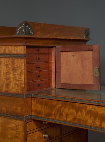 Regency flash mahogany and ebonized desk of double pylon architectural form