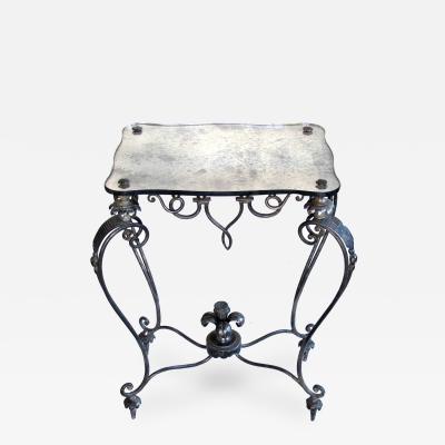 Ren Drouet An elegant French iron and tole table with mirrored top Rene Drouet