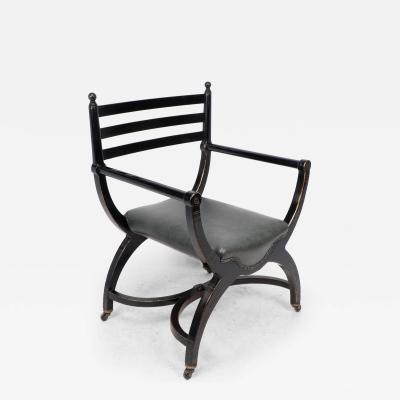 Richard Charles Richard Charles Aesthetic Movement Ebonised Elbow Chair with X Frame Stretcher
