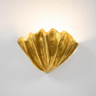 Robert Goossens Shell shaped wall light in gilded bronze