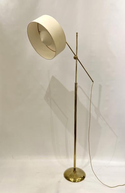 Robert Mathieu Polished brass floor lamp in the style of Robert Mathieu France circa 1950