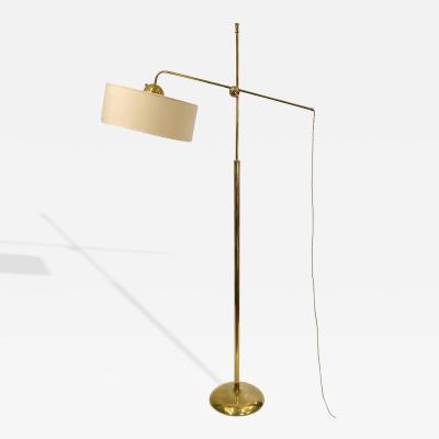 Robert Mathieu Polished brass floor lamp in the style of Robert Mathieu France circa 1950
