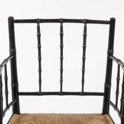 Robert William Edis Robert W Edis an Aesthetic Movement Rush Seat Armchair in the Bamboo Style