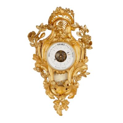 Rococo style gilt bronze cartel clock and barometer
