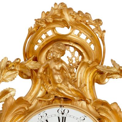 Rococo style gilt bronze cartel clock and barometer