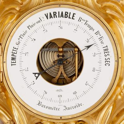 Rococo style gilt bronze cartel clock and barometer