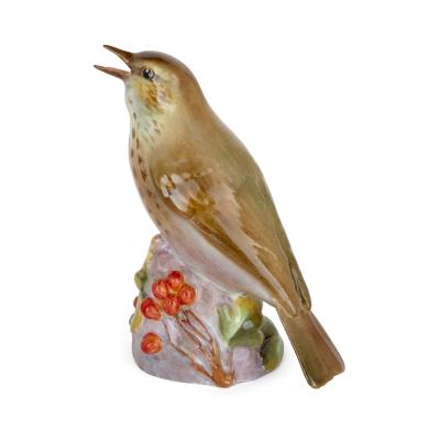 Royal Worcester Two Royal Worcester porcelain bird models of a kingfisher and a thrush