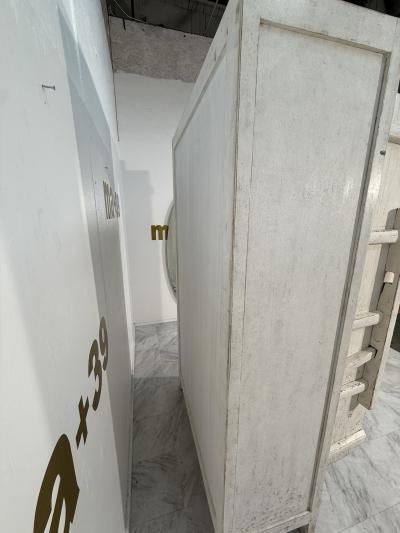 Rustic Whitewashed Wooden Armoire with Geometric Relief Doors