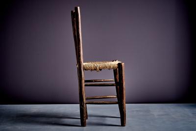 Rustic ladder back chair with straw seat