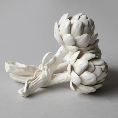 SCULPTURE OF THREE BABY ARTICHOKES TIED WITH A RIBBON 