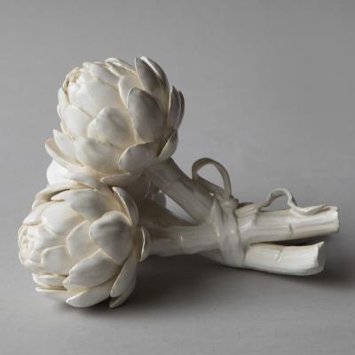 SCULPTURE OF THREE BABY ARTICHOKES TIED WITH A RIBBON 