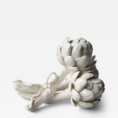 SCULPTURE OF THREE BABY ARTICHOKES TIED WITH A RIBBON 