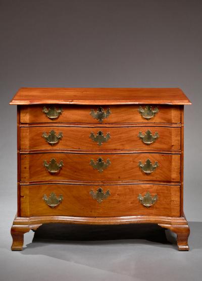 SERPENTINE CHEST WITH OGEE FEET AND BLOCKED ENDS