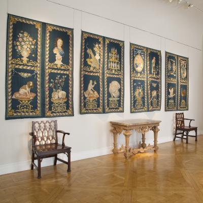 SET OF EIGHT NEEDLEPAINTED CREWELWORK HANGINGS DEPICTING ANIMALS STILL LIFES