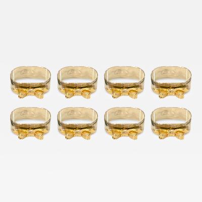 SET OF EIGHT SIVERPLATE GOLDTONE BOW DESIGN NAPKIN RINGS