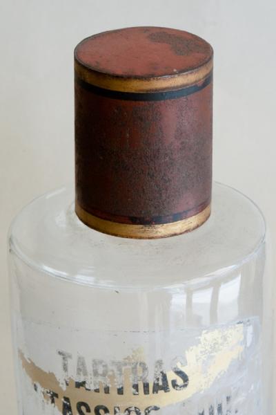 SET OF FOUR HAND BLOWN GLASS APOTHECARY BOTTLES WITH GILT AND RED TOPS