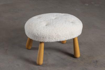SHEEPSKIN UPHOLSTERED OTTOMAN