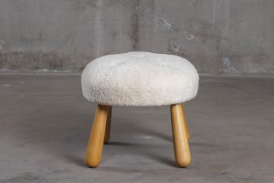 SHEEPSKIN UPHOLSTERED OTTOMAN