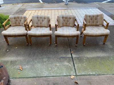 SUITE OF FOUR MODERN OLIVE WOOD DINING CHAIRS ON CASTERS
