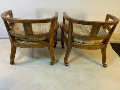 SUITE OF FOUR MODERN OLIVE WOOD DINING CHAIRS ON CASTERS