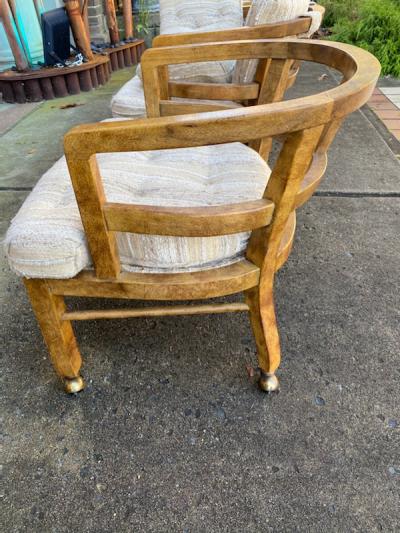 SUITE OF FOUR MODERN OLIVE WOOD DINING CHAIRS ON CASTERS