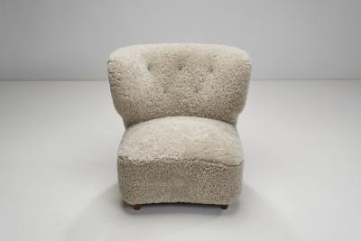 Scandinavian Easy Chairs in Sheepskin with Ottomans Scandinavia ca 1950s
