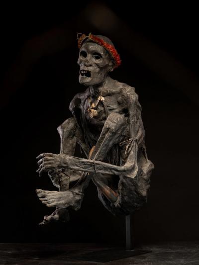 Sculptured model of a smoked Papua Mummie papier m ch 20th C