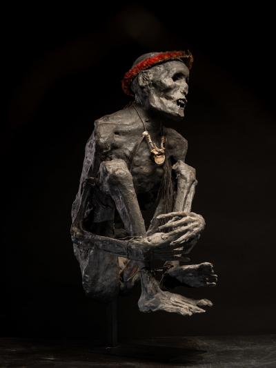 Sculptured model of a smoked Papua Mummie papier m ch 20th C