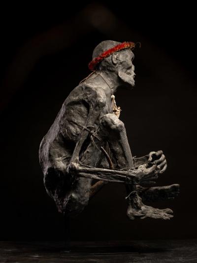 Sculptured model of a smoked Papua Mummie papier m ch 20th C