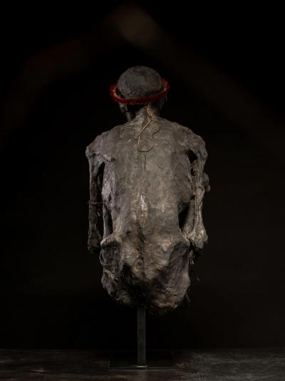 Sculptured model of a smoked Papua Mummie papier m ch 20th C