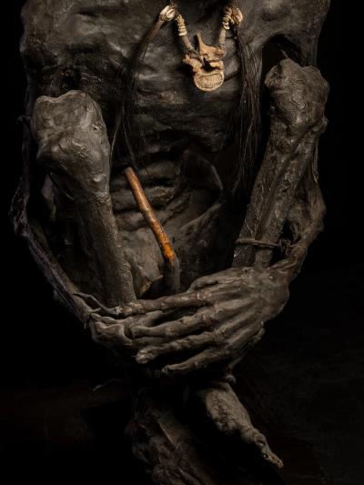 Sculptured model of a smoked Papua Mummie papier m ch 20th C