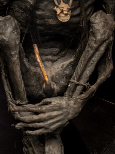 Sculptured model of a smoked Papua Mummie papier m ch 20th C