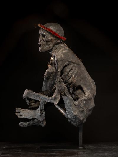 Sculptured model of a smoked Papua Mummie papier m ch 20th C