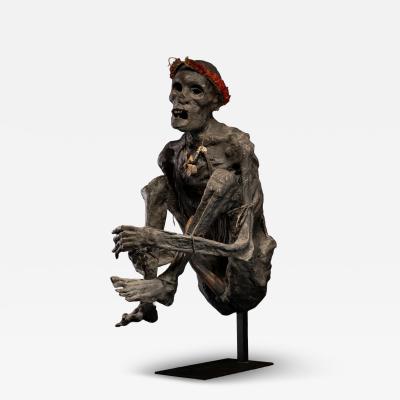 Sculptured model of a smoked Papua Mummie papier m ch 20th C