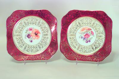 Set of 11 German maroon colored porcelain dessert plates with floral design