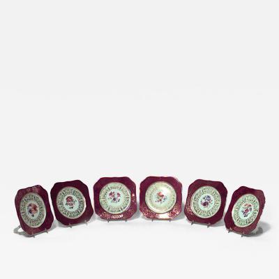 Set of 11 German maroon colored porcelain dessert plates with floral design