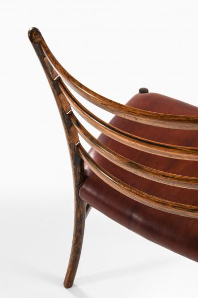 Set of 12 Dining Chairs in Rosewood and Leather 1960s