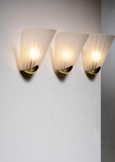 Set of 3 brass and glass wall lamps