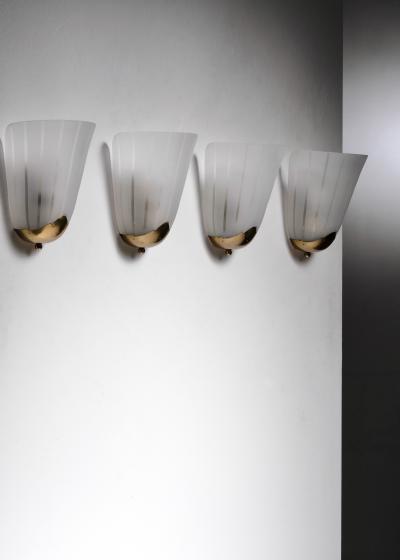 Set of 4 brass and glass wall lamps