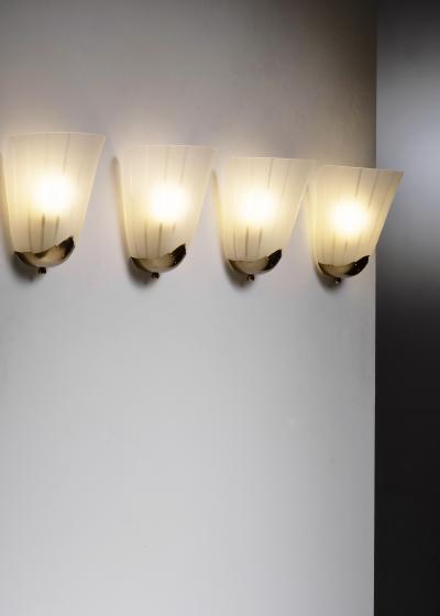 Set of 4 brass and glass wall lamps