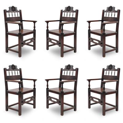 Set of 7 English Renaissance Spindle and Crest Walnut Armchairs