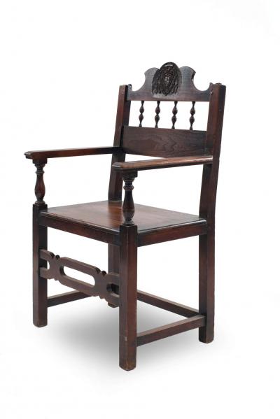 Set of 7 English Renaissance Spindle and Crest Walnut Armchairs