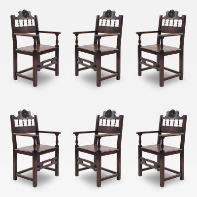 Set of 7 English Renaissance Spindle and Crest Walnut Armchairs