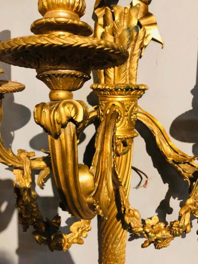 Set of Four Large Ornate Three Light Torch and Ribbon Form Wall Sconces