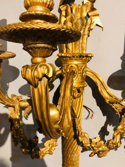 Set of Four Large Ornate Three Light Torch and Ribbon Form Wall Sconces