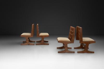 Set of Four Oak Dining Chairs with Geometric Backs Europe Mid 20th Century
