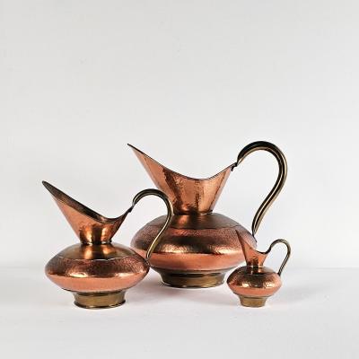 Set of Three Vintage Copper Pitchers