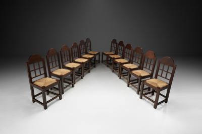 Set of Twelve Oak and Straw Dining Chairs with Geometric Backs Spain ca 1930s