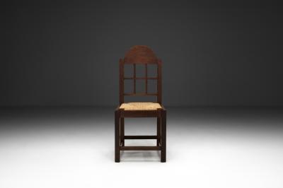 Set of Twelve Oak and Straw Dining Chairs with Geometric Backs Spain ca 1930s