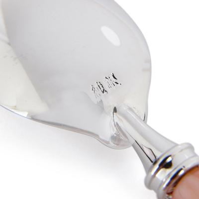 Set of five red coral and silver spoons